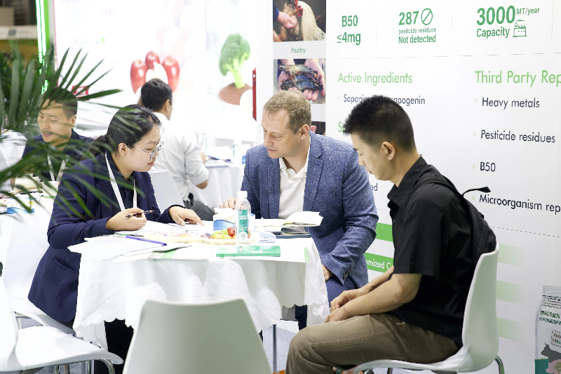 Wellgreen sales team consulting client at booth Wellgreen sales team consulting client at booth